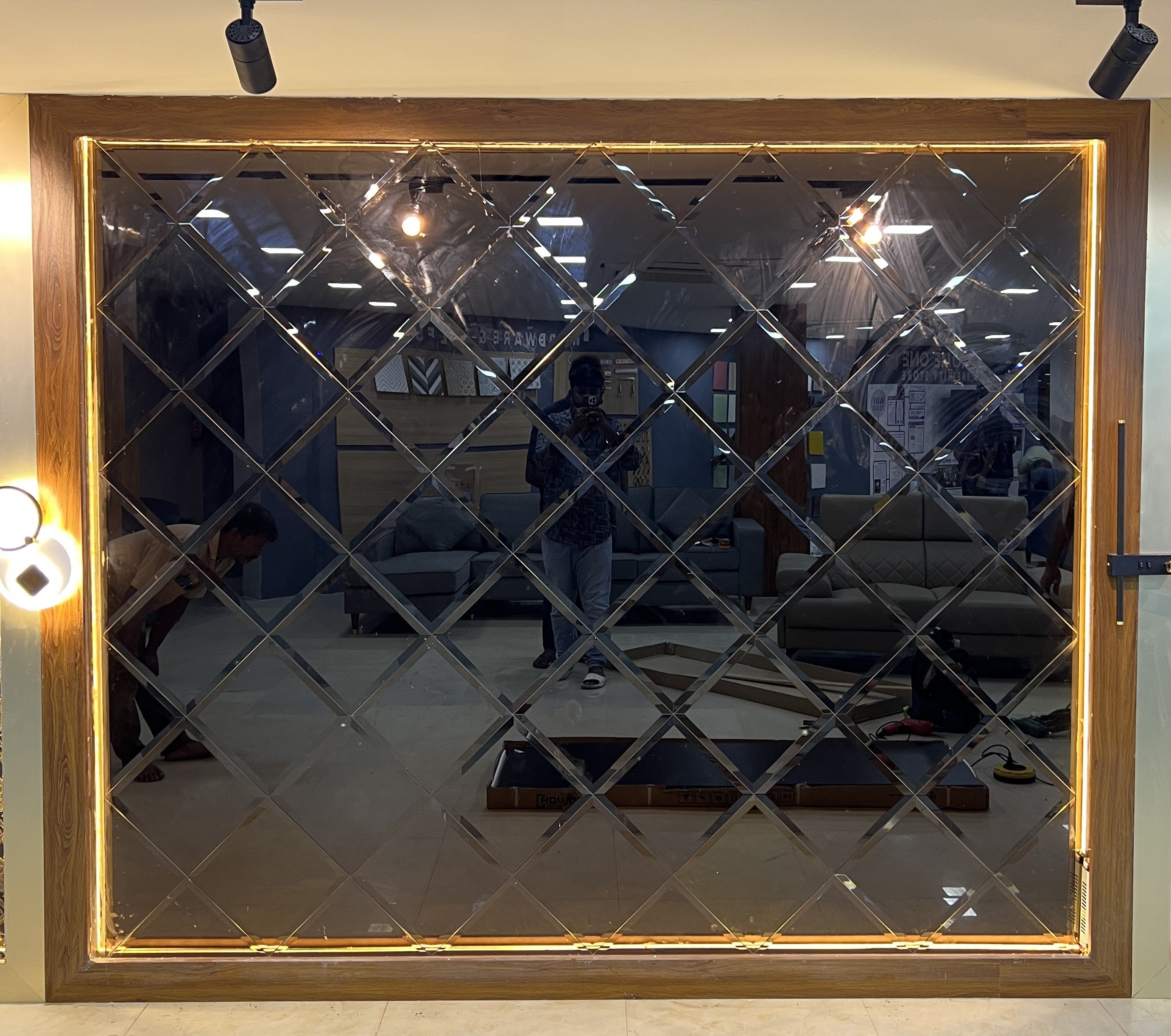 Exquisite Foyer Design Featuring a Beveled Bronze Mirror